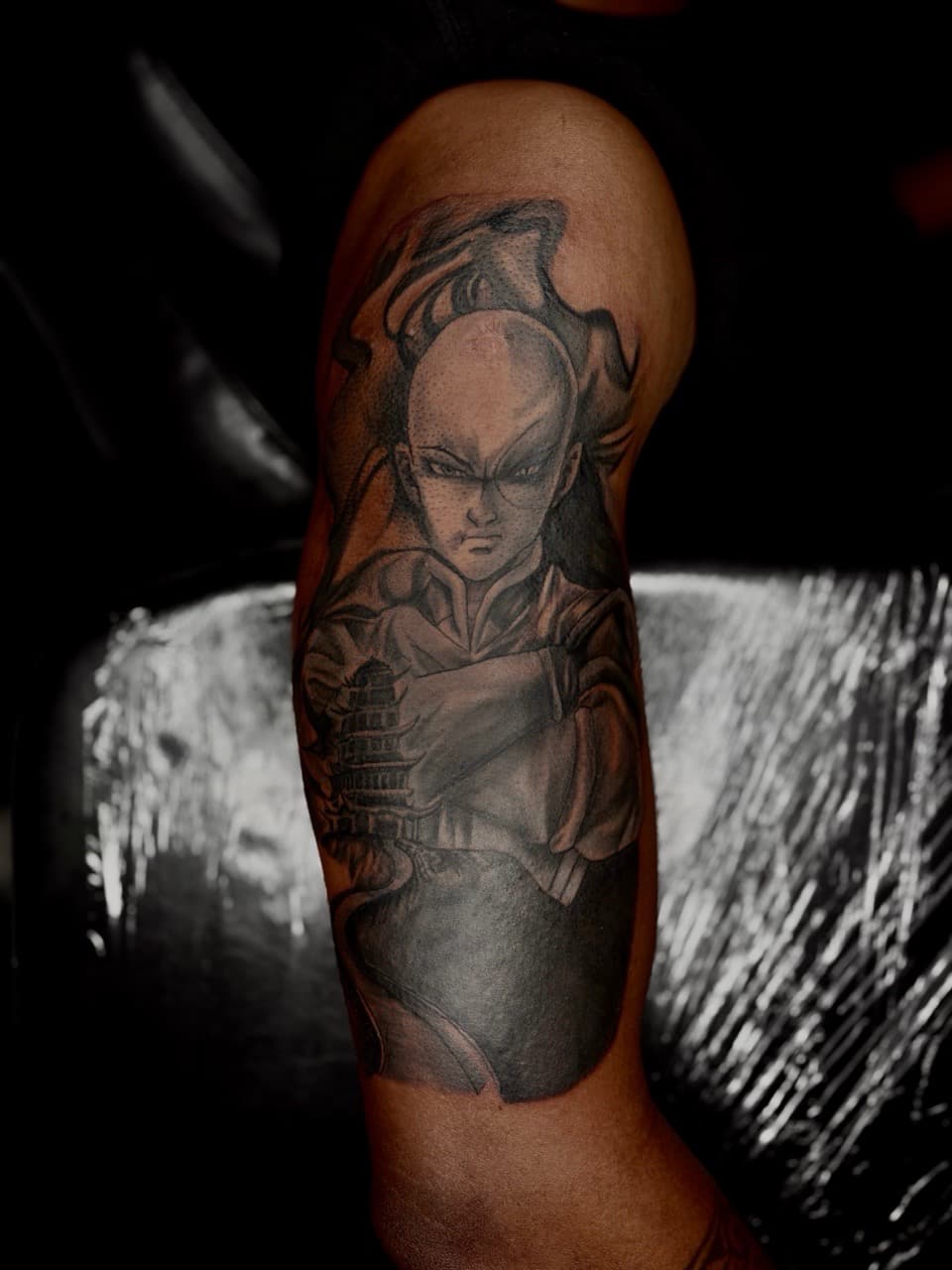 Black & Grey + Anime bald figure tattoo on Upper Arm by Arttrigga on TattMe