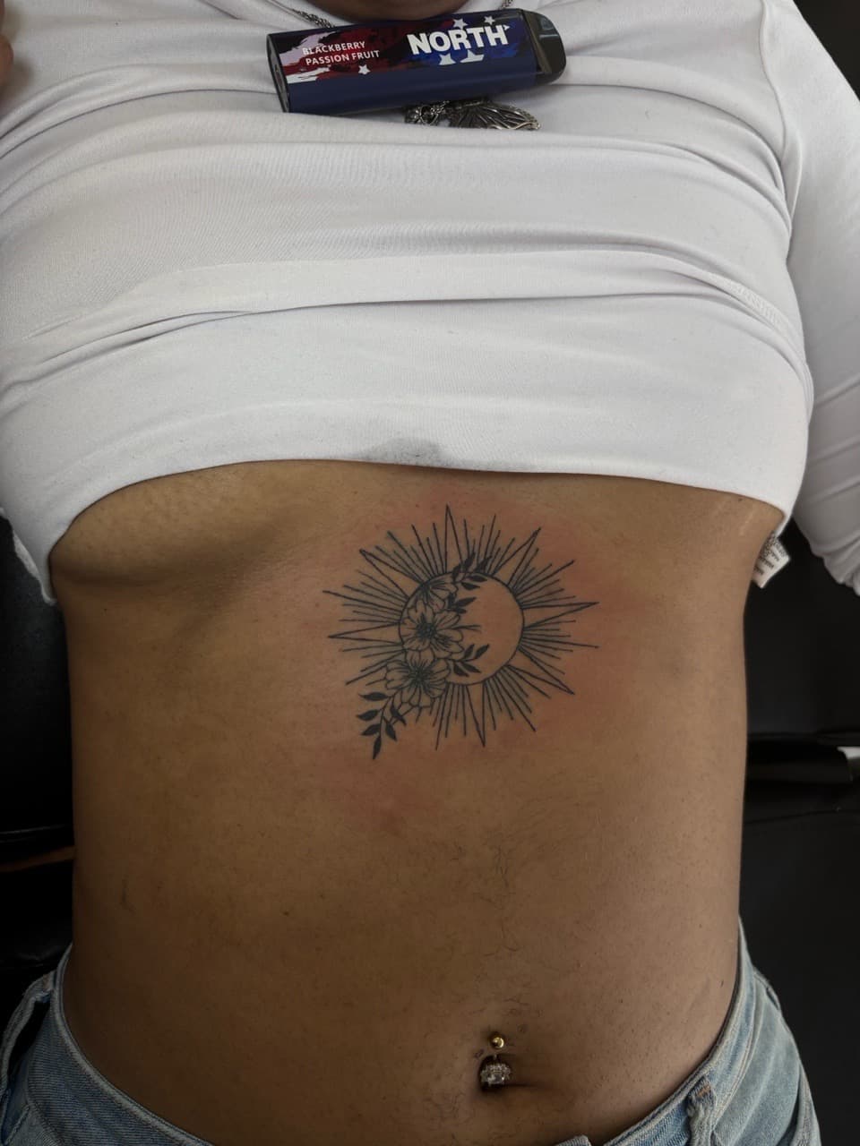 Fine Line + Black-work sun tattoo on Ribs by inkedbyshyllc on TattMe