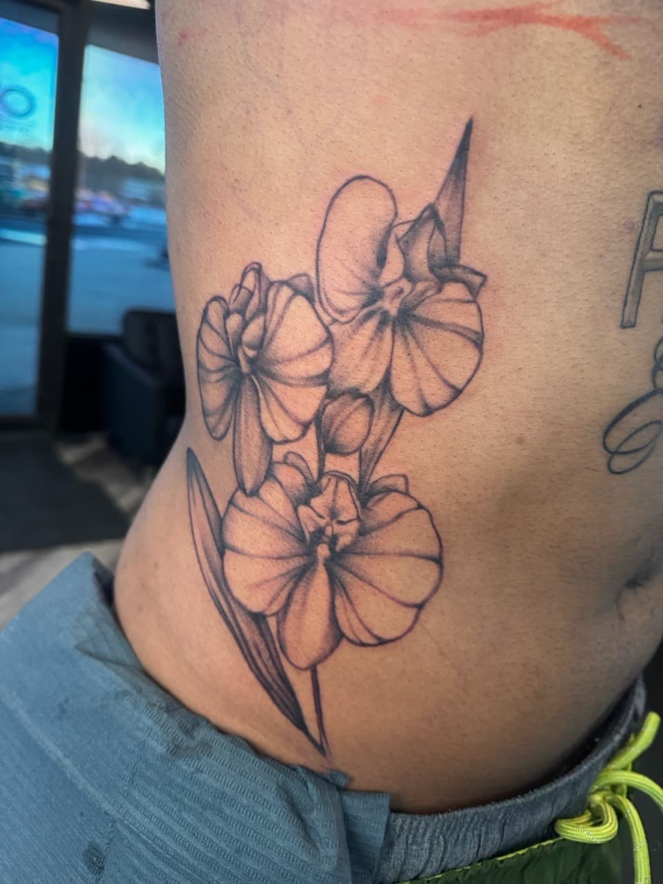 Floral + Black & Grey flowers tattoo on Ribs by Ink_by_Noble on TattMe