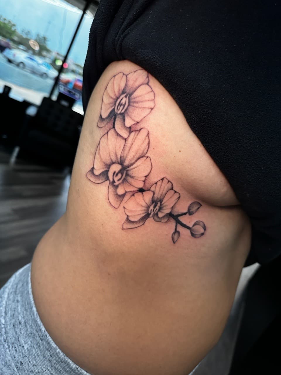 Fine Line + Black & Grey orchids tattoo on Ribs by Ink_by_Noble on TattMe