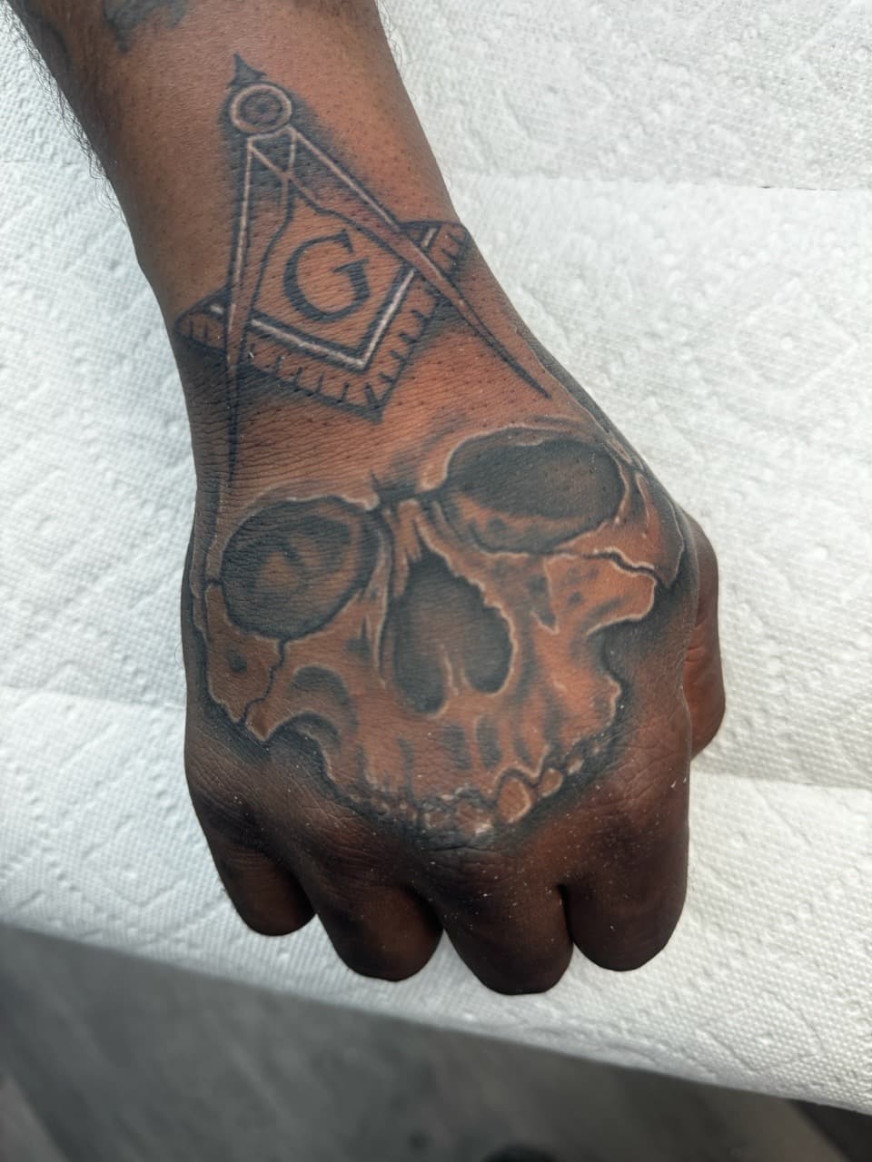 Black & Grey + Illustrative skull tattoo on Hand by Ink_by_Noble on TattMe