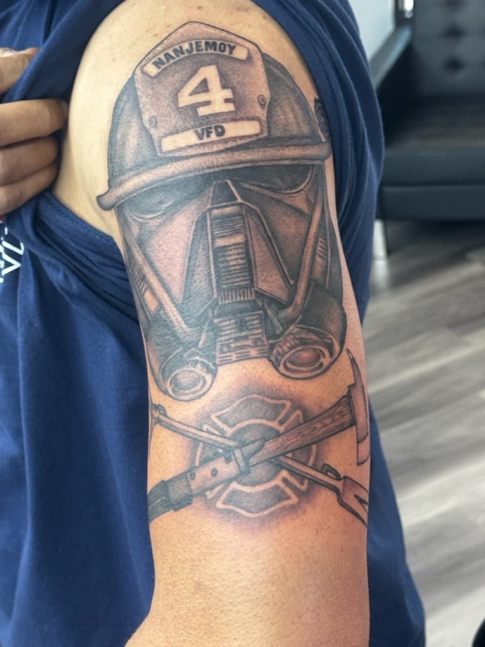 Black & Grey + Illustrative firefighter helmet tattoo on Upper Arm by Ink_by_Noble on TattMe