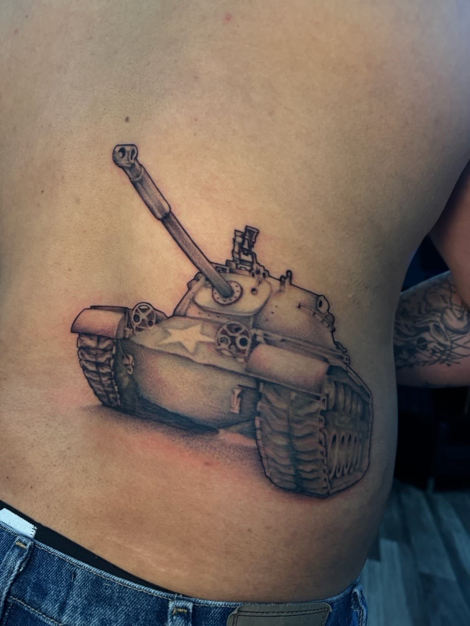 Black & Grey + Realism tank tattoo on Ribs by Ink_by_Noble on TattMe