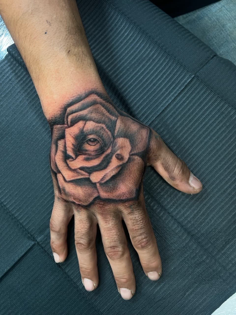 Black & Grey + Realism rose tattoo on Hand by Ink_by_Noble on TattMe