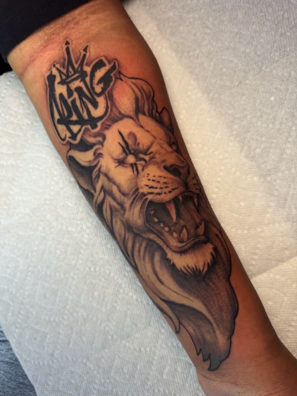 Black & Grey + Illustrative lion tattoo on Forearm by Ink_by_Noble on TattMe
