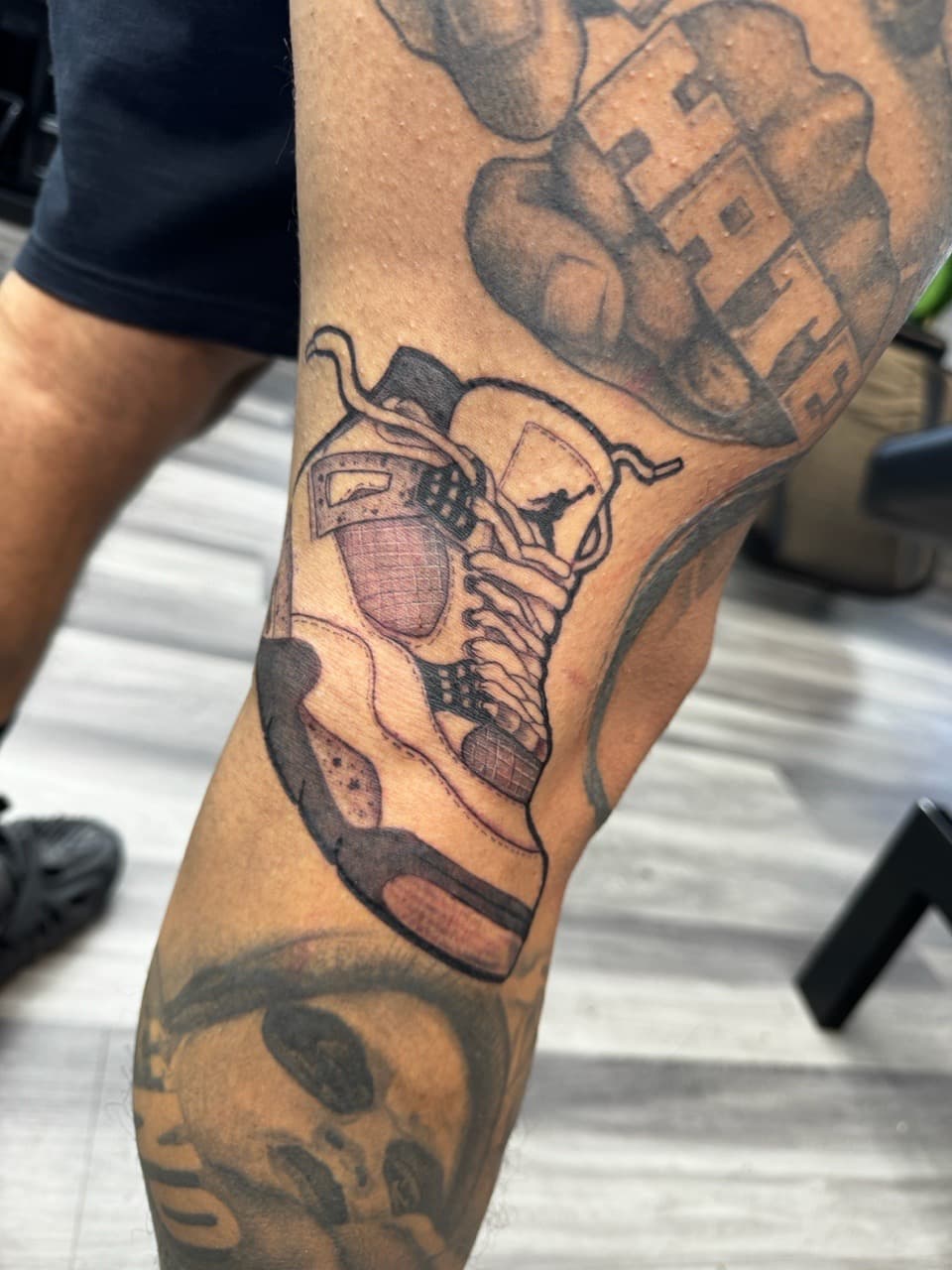 Black & Grey + Illustrative sneaker tattoo on Knee by Ink_by_Noble on TattMe