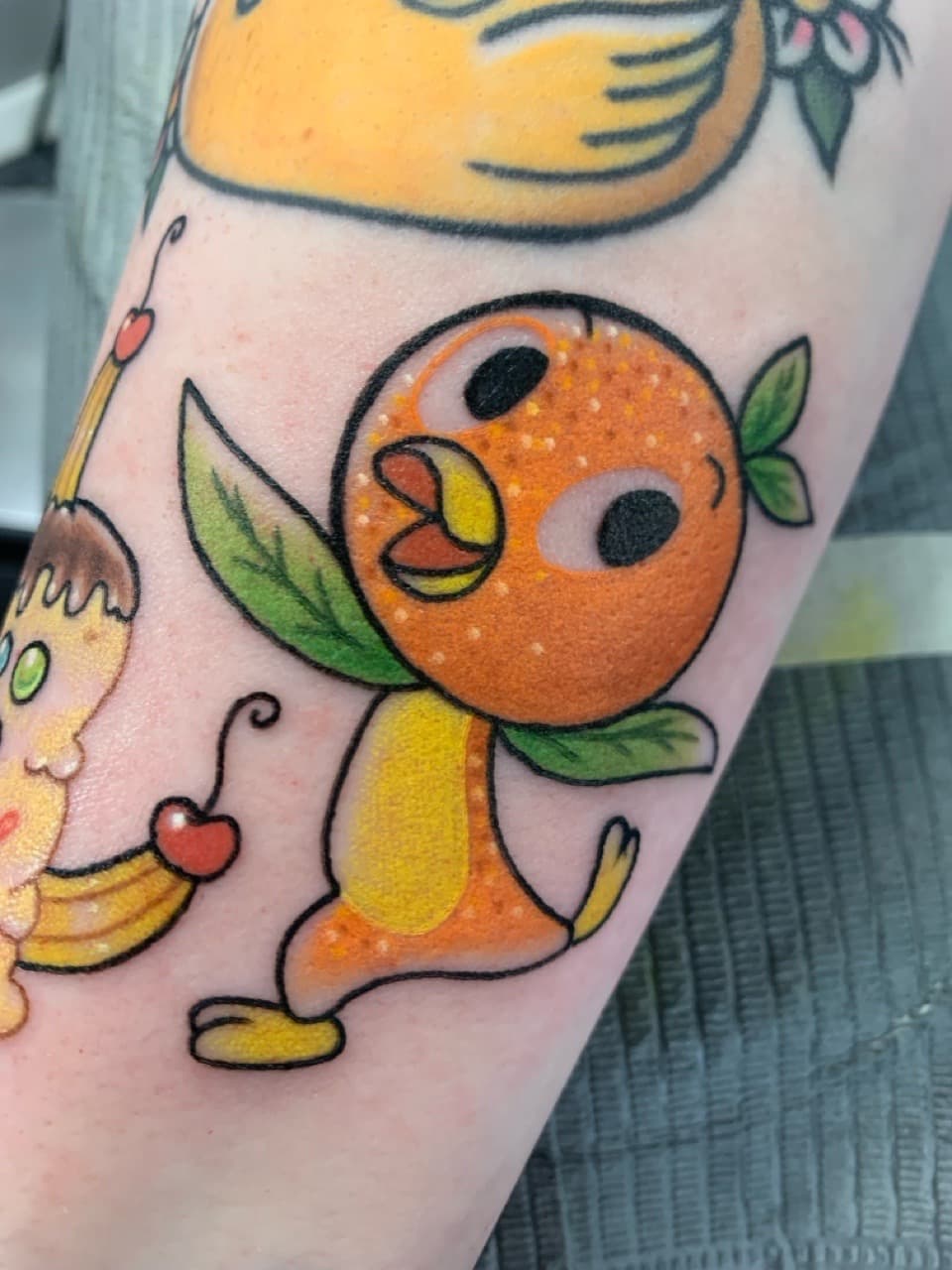 New School + Pop Culture orange bird tattoo on Upper Arm by Mads_TwoTone_Roy on TattMe