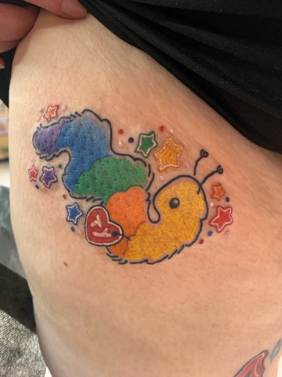 Cartoon + Color caterpillar tattoo on Ribs by Mads_TwoTone_Roy on TattMe