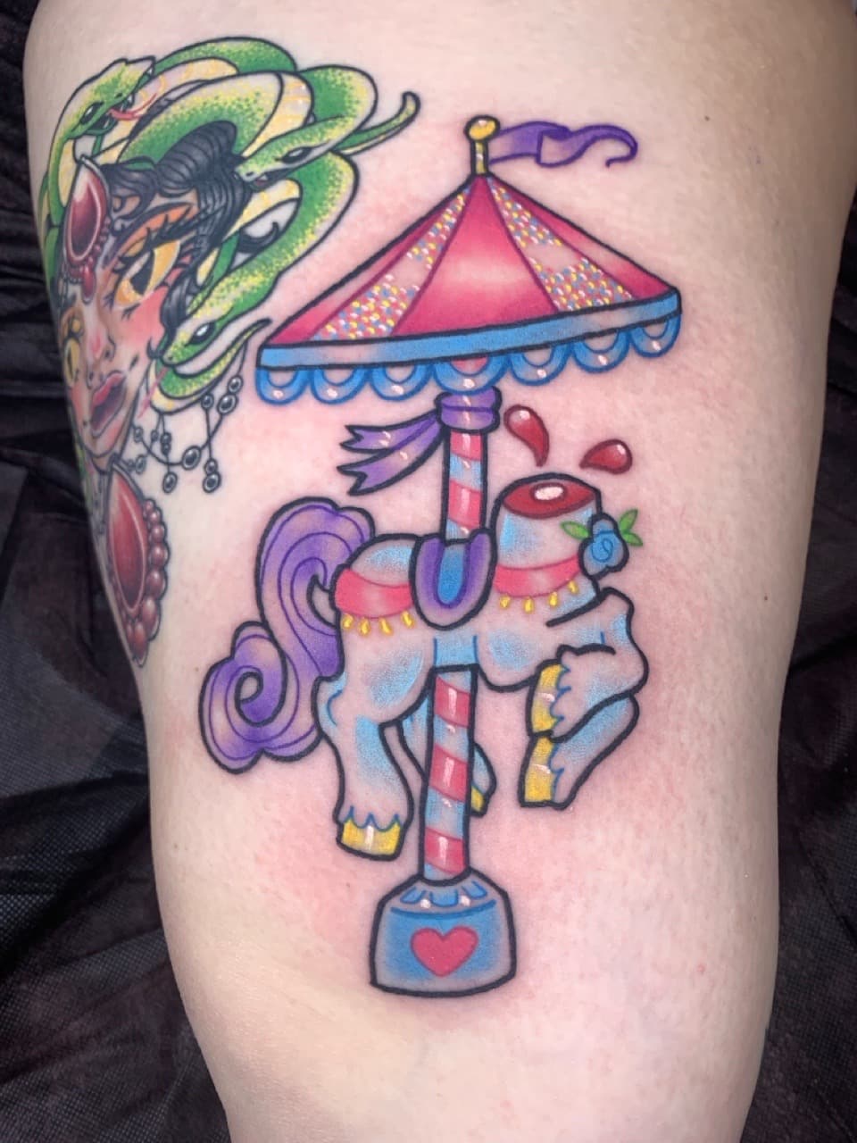 Color + New School carousel horse tattoo on Thigh by Mads_TwoTone_Roy on TattMe