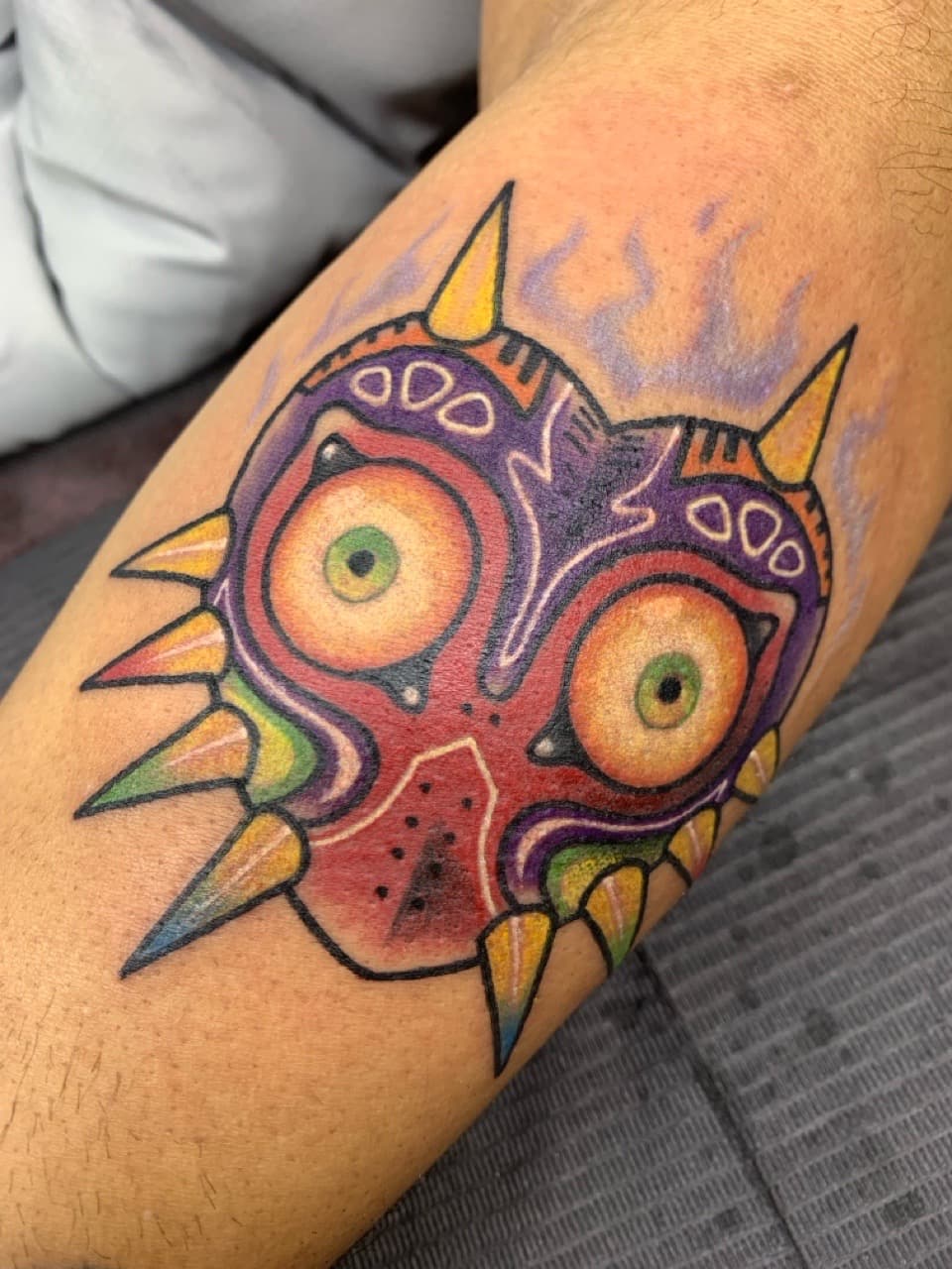Color + New School mask tattoo on Upper Arm by Mads_TwoTone_Roy on TattMe