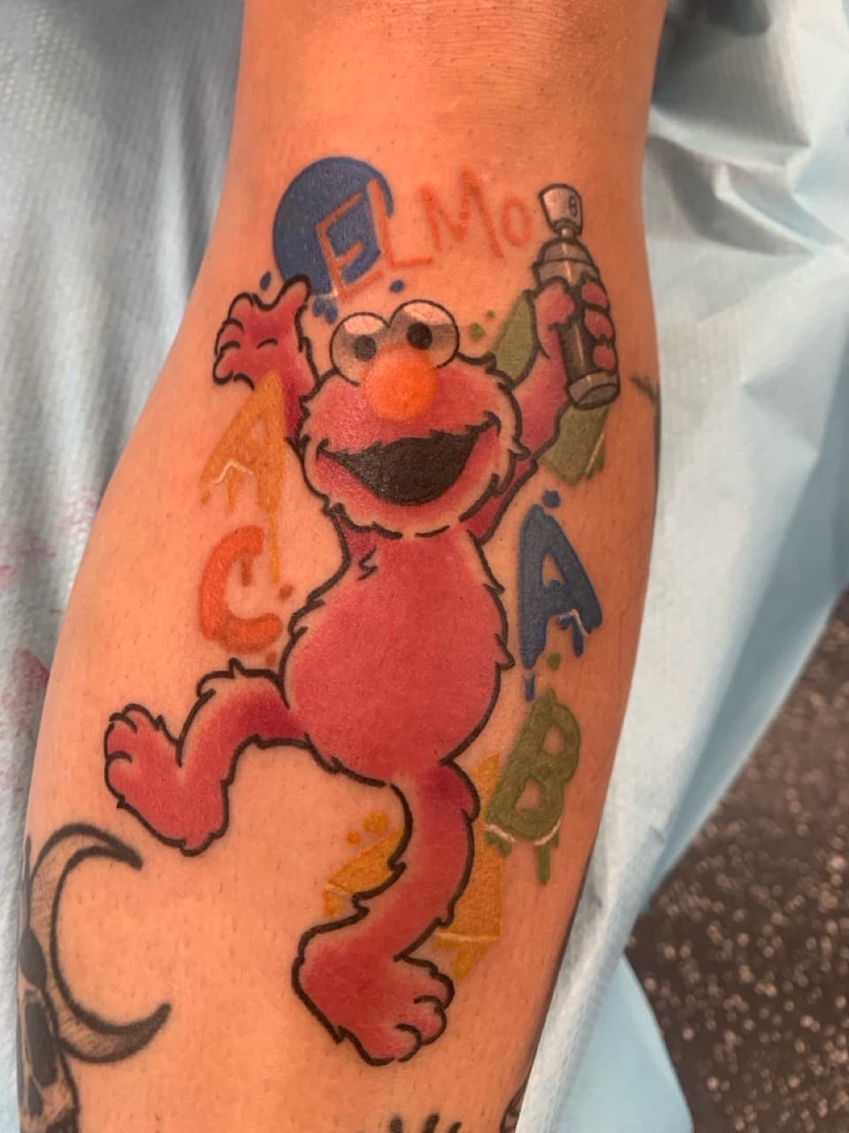 Cartoon + Color elmo tattoo on Forearm by Mads_TwoTone_Roy on TattMe