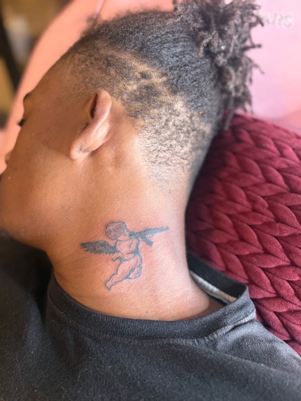 Black & Grey + Illustrative cherub tattoo on Neck (Side) by Tattoos_Wit_ZaZa on TattMe