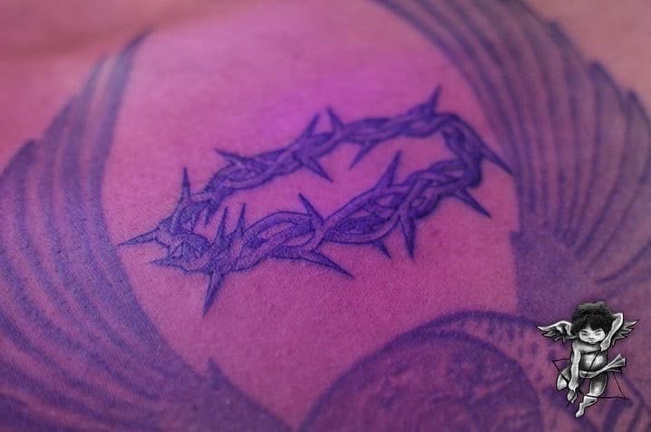 Line-work crown of thorns tattoo on Upper Back by Global_Ink_Tattoos on TattMe