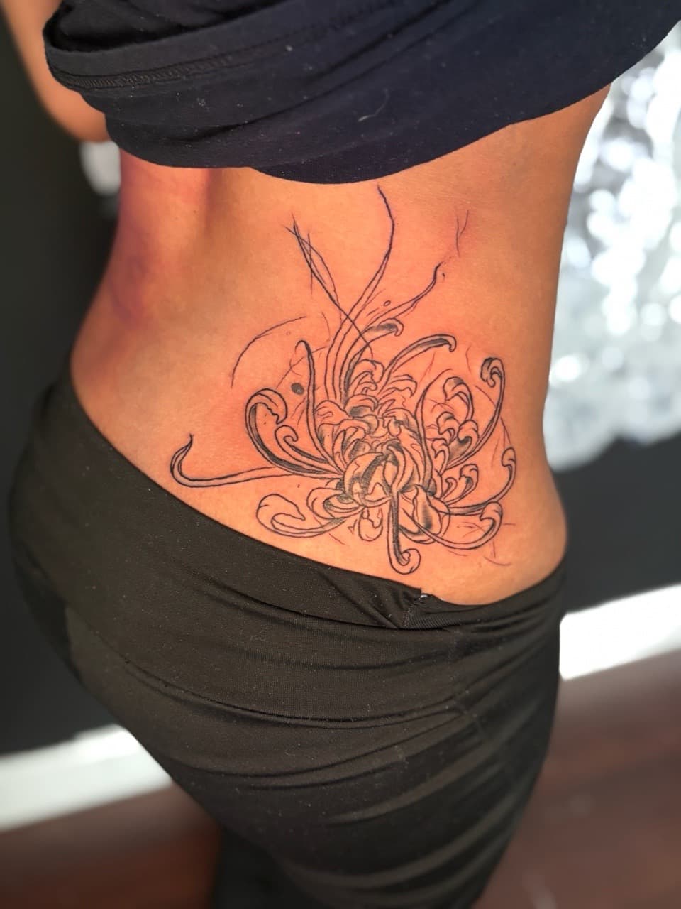 Fine Line + Floral chrysanthemum tattoo on Lower Back by Lottooink on TattMe