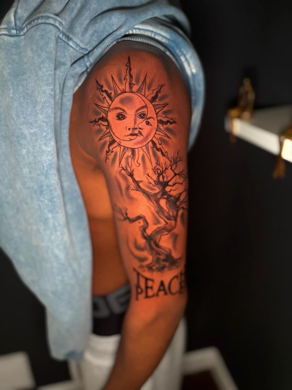 Black & Grey + Illustrative sun tattoo on Upper Arm by Lottooink on TattMe
