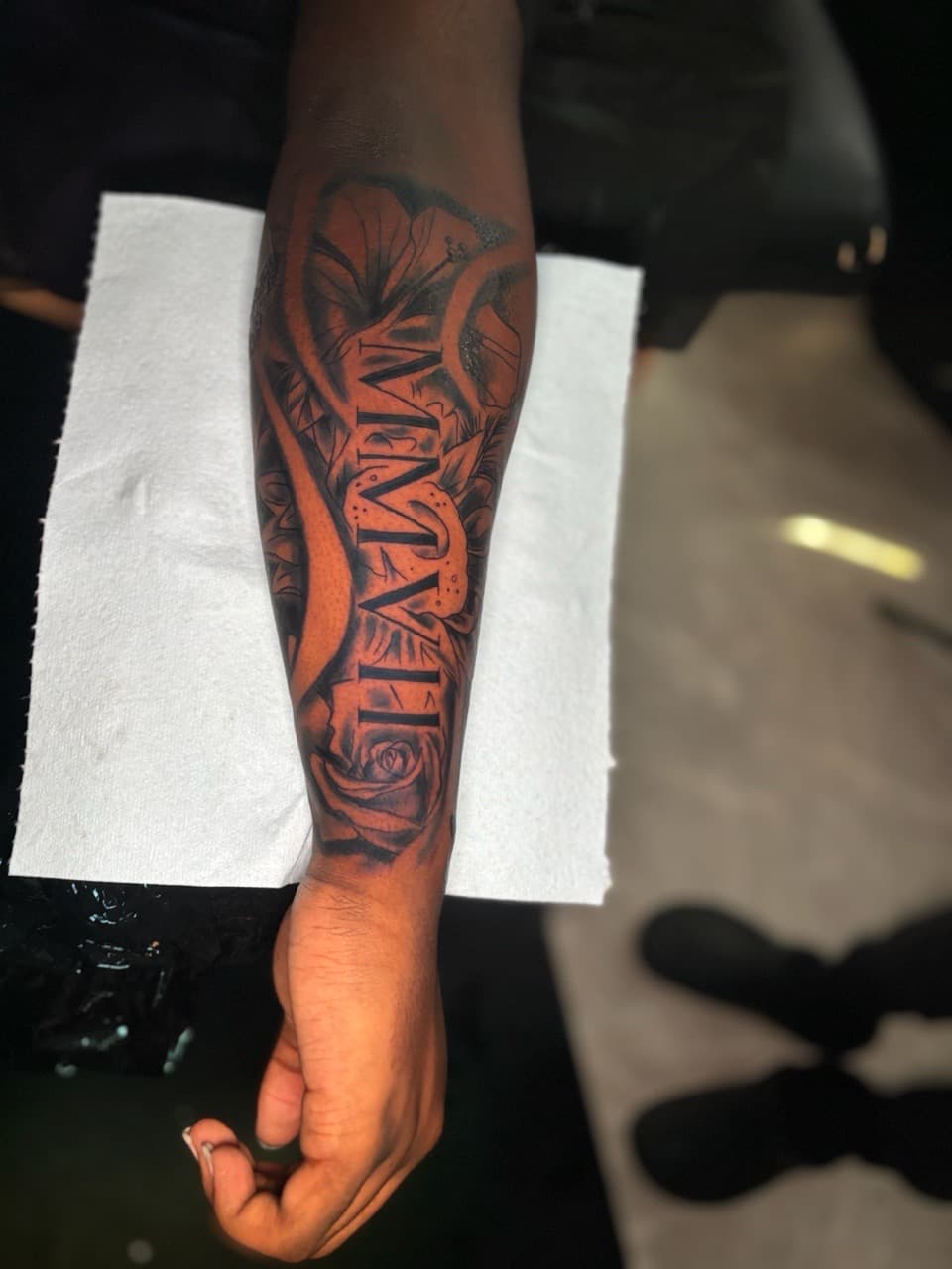 Black & Grey + Floral roman numerals tattoo on Forearm by Lottooink on TattMe