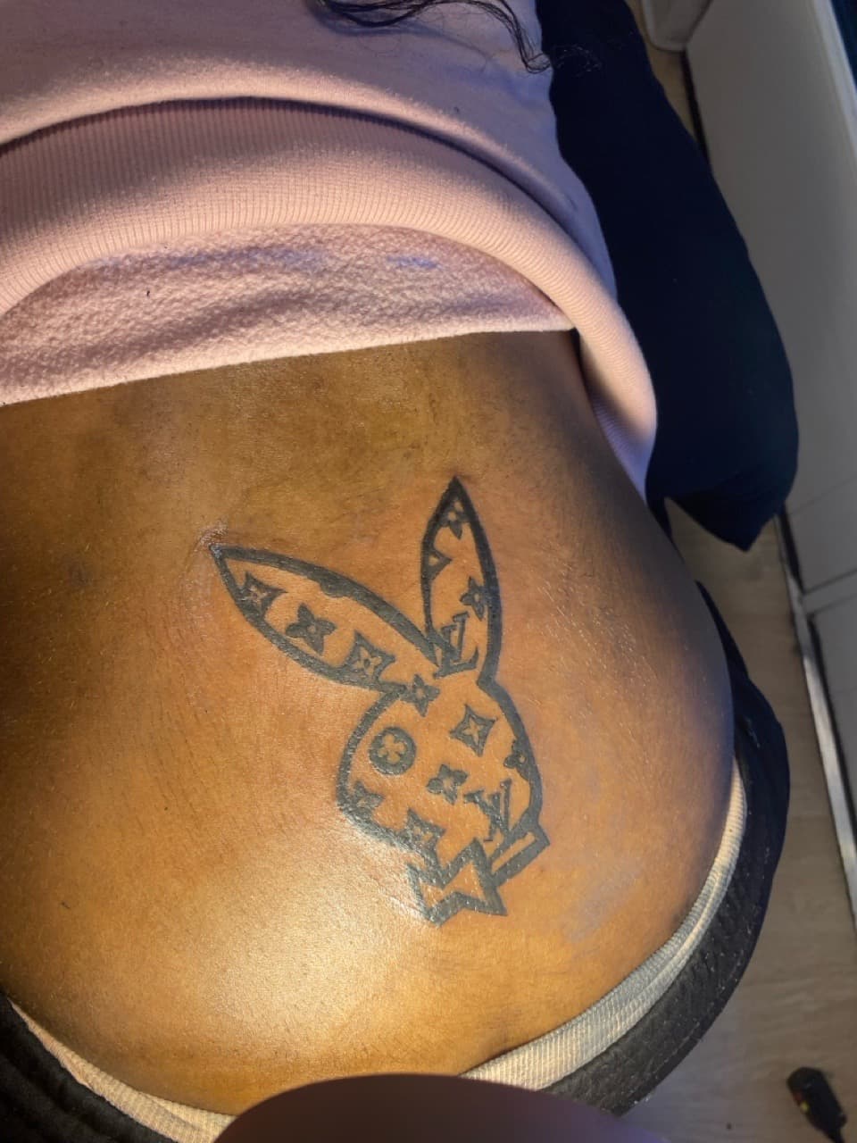 Pop Culture + Line-work playboy bunny tattoo on Lower Back by ONEWAY_Ink on TattMe