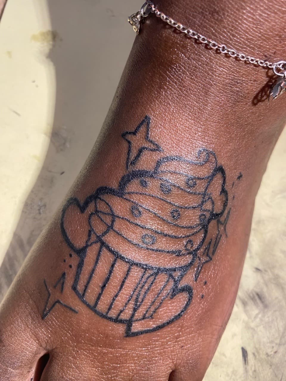 Black-work + Illustrative cupcake tattoo on Foot by ONEWAY_Ink on TattMe