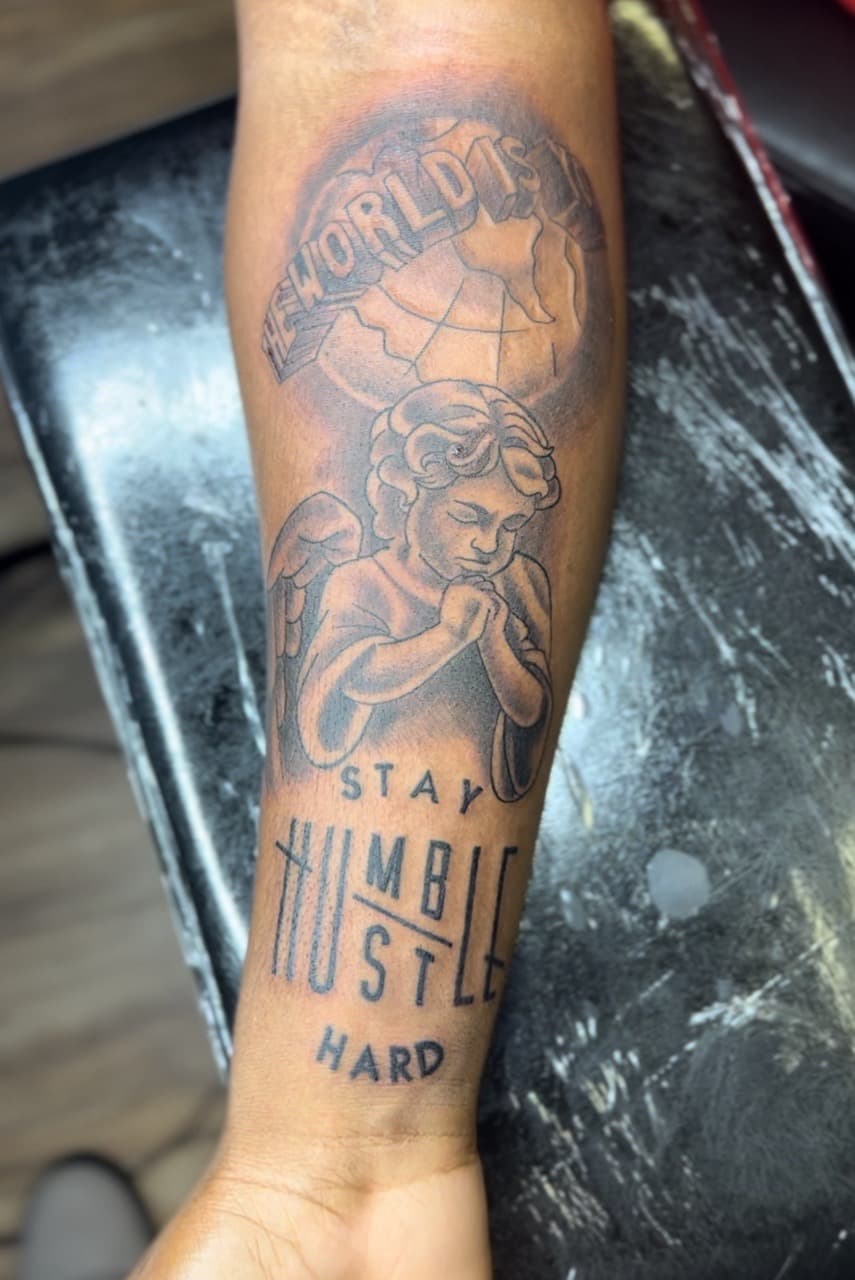 Black & Grey + Lettering cherub tattoo on Forearm by Jay on TattMe