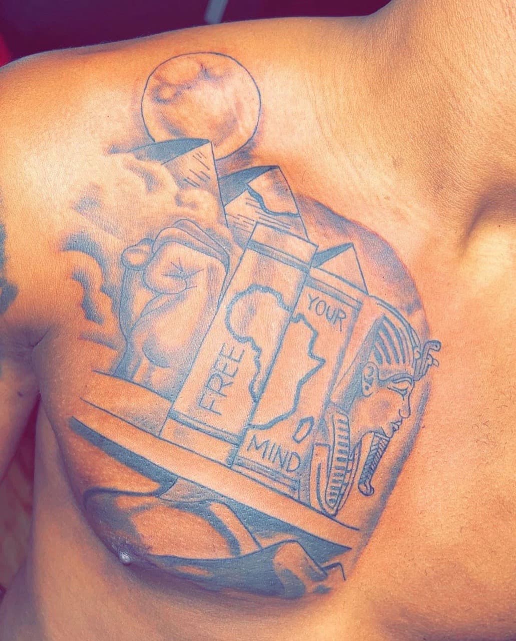 Black & Grey + Illustrative fist tattoo on Chest by Jay on TattMe