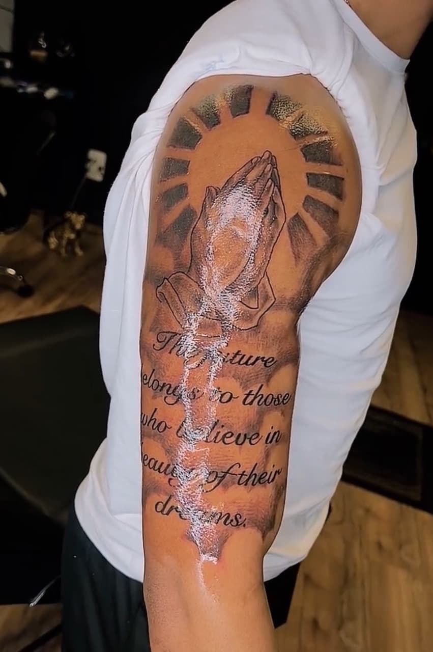 Black & Grey + Lettering praying hands tattoo on Upper Arm by Jay on TattMe
