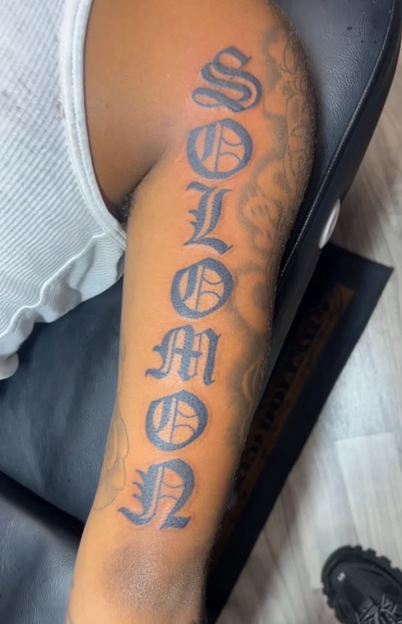 Lettering + Script name tattoo on Upper Arm by Jay on TattMe