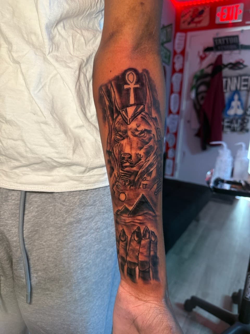 Black & Grey + Illustrative anubis tattoo on Forearm by Inkbyjmoney on TattMe