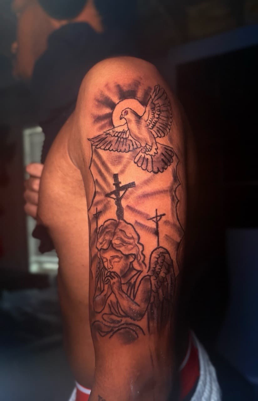Black & Grey + Illustrative angel tattoo on Upper Arm by Inkbyjmoney on TattMe