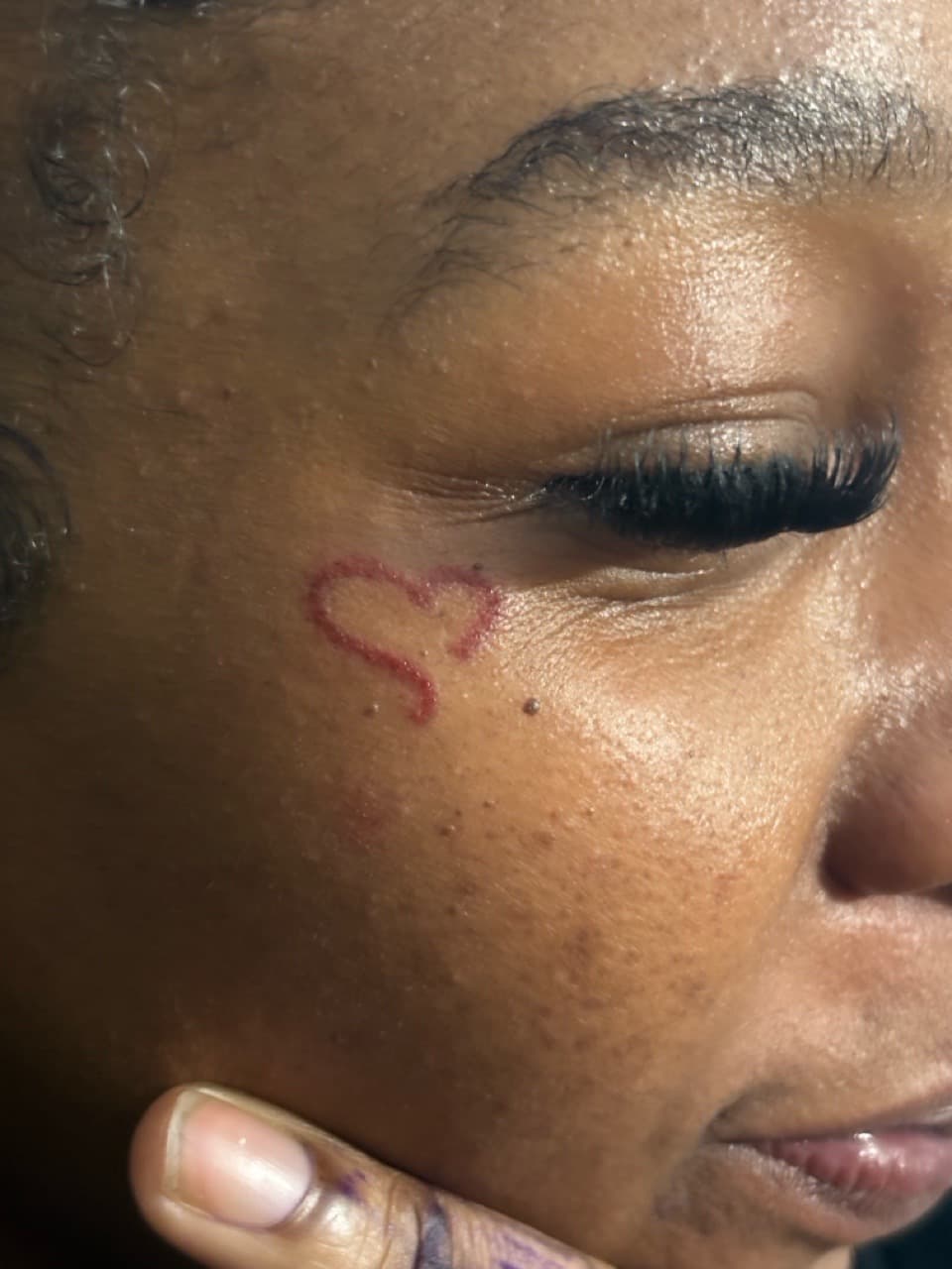 Fine Line + Minimalist heart tattoo on Face by 3inkd on TattMe