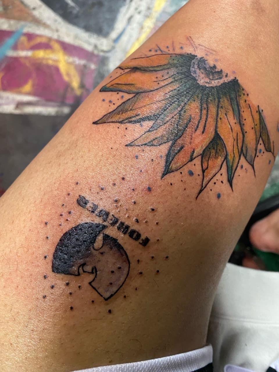 Color + Black-work sunflower tattoo on Thigh by The_Supplier_Tattoo on TattMe