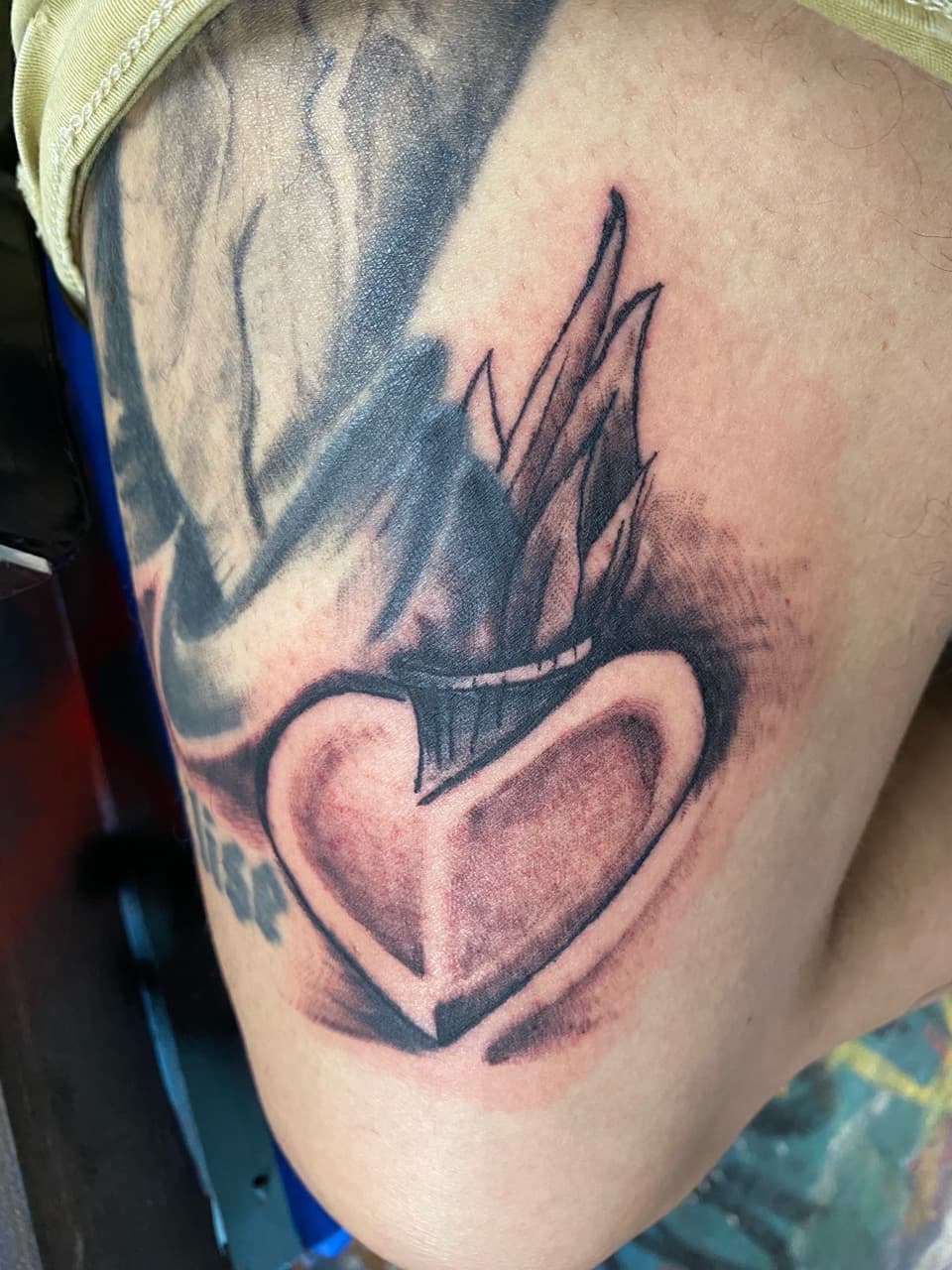 Black & Grey + Illustrative heart tattoo on Upper Arm by The_Supplier_Tattoo on TattMe