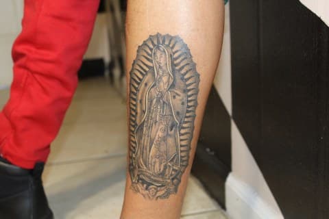 Black & Grey + Illustrative virgin mary tattoo on Calf by Juu on TattMe
