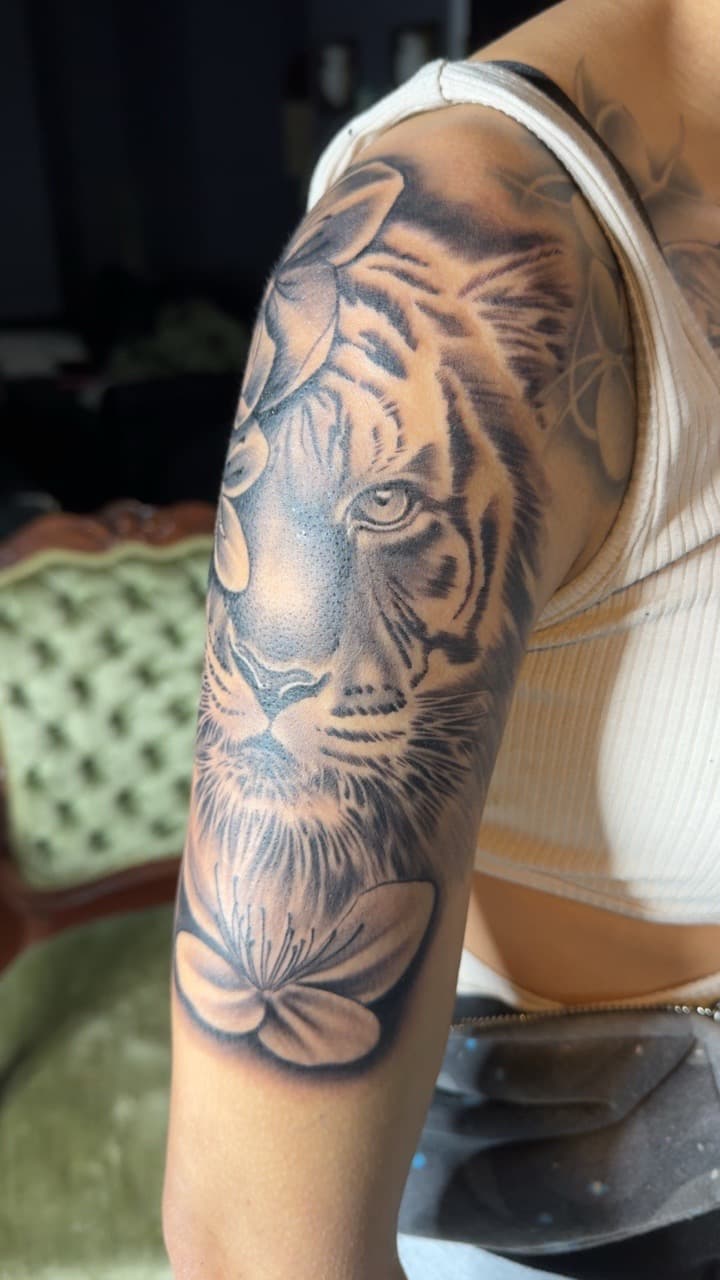 Black & Grey + Realism tiger tattoo on Upper Arm by Juu on TattMe