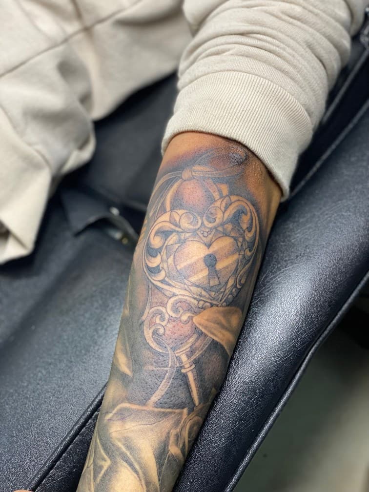 Black & Grey + Illustrative heart tattoo on Forearm by Juu on TattMe