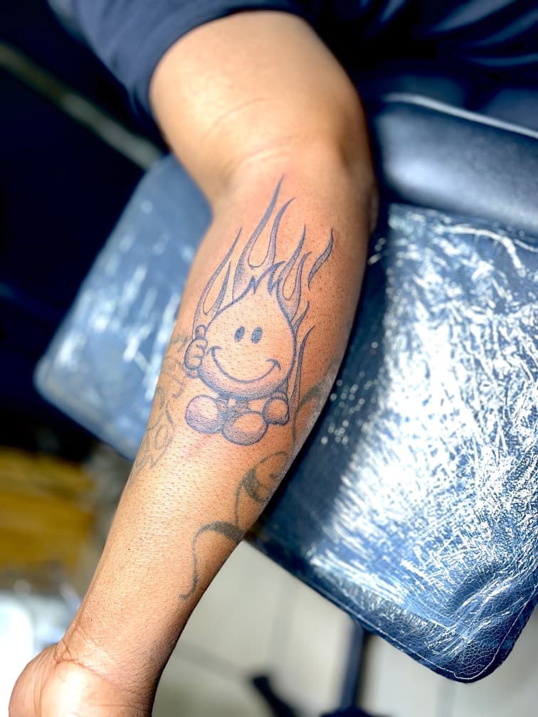 Line-work + Cartoon smiley face tattoo on Forearm by Juu on TattMe