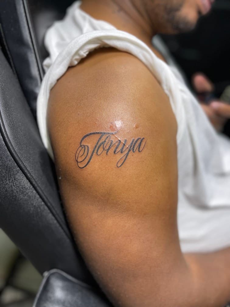 Lettering + Script name tattoo on Upper Arm by Juu on TattMe