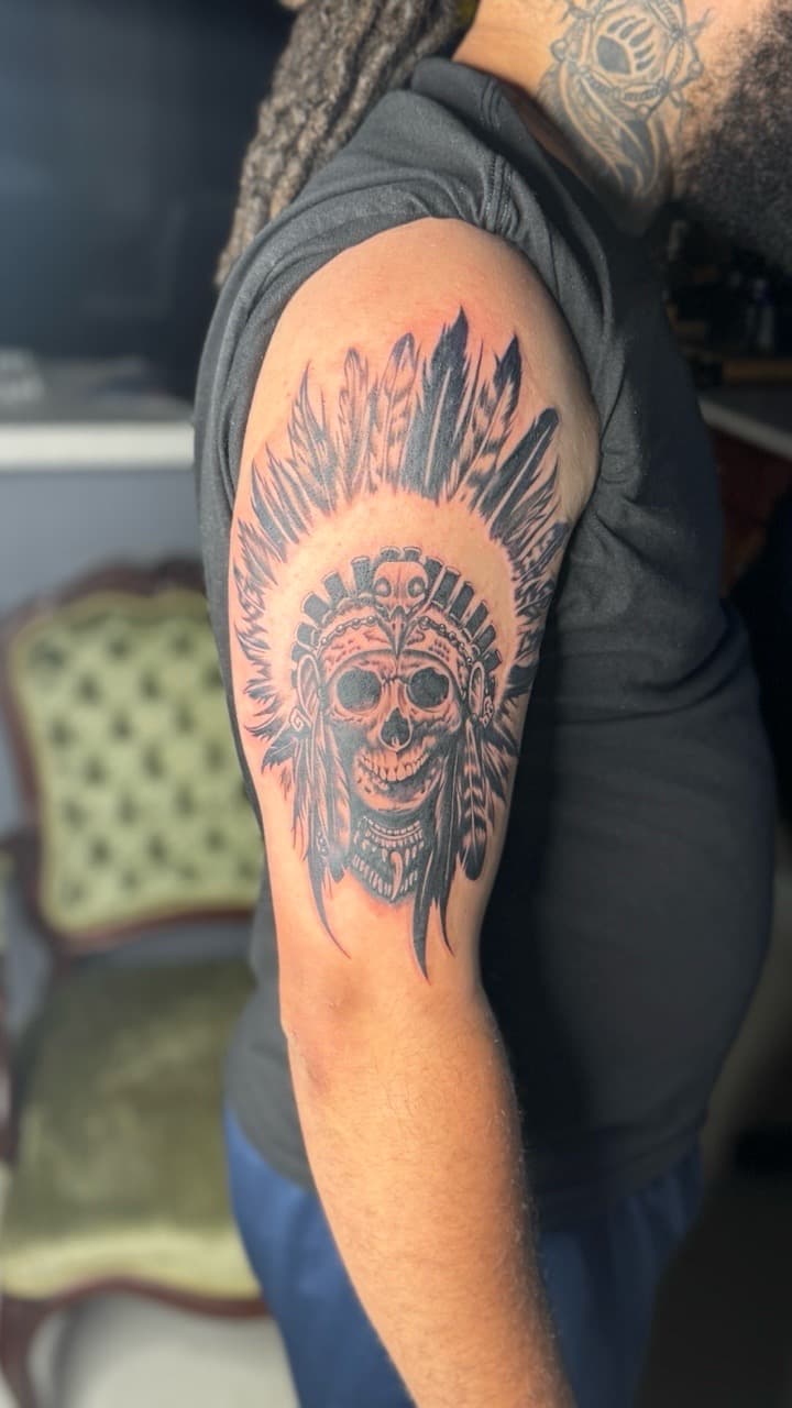 Black & Grey + Illustrative skull tattoo on Upper Arm by Juu on TattMe