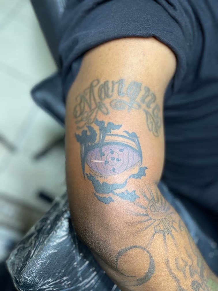 Anime + Lettering rinnegan tattoo on Upper Arm by Juu on TattMe