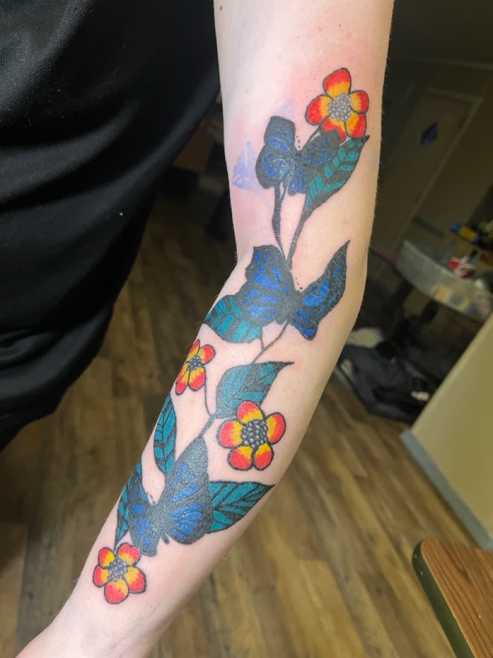 Color + Floral flowers tattoo on Forearm by ink_queens_VICTORIA on TattMe