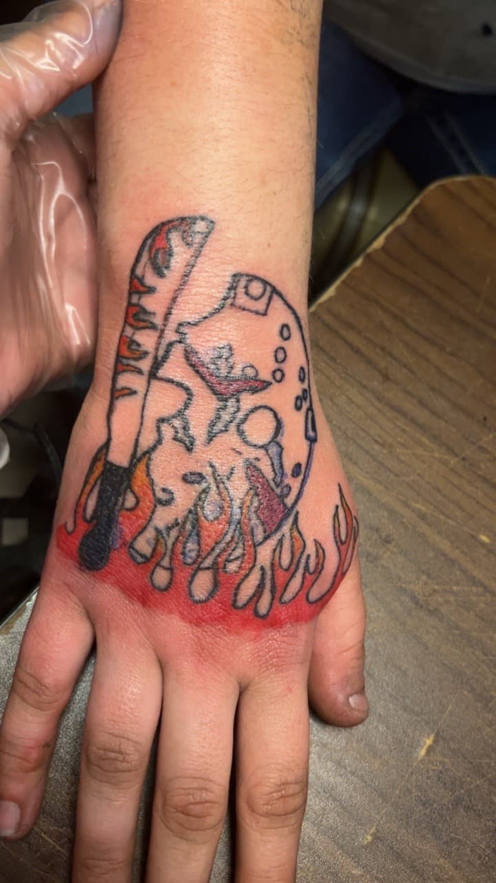 New School + Illustrative hockey mask tattoo on Hand by ink_queens_VICTORIA on TattMe