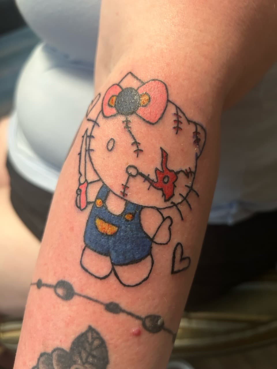 Color + Cartoon hello kitty tattoo on Forearm by ink_queens_VICTORIA on TattMe