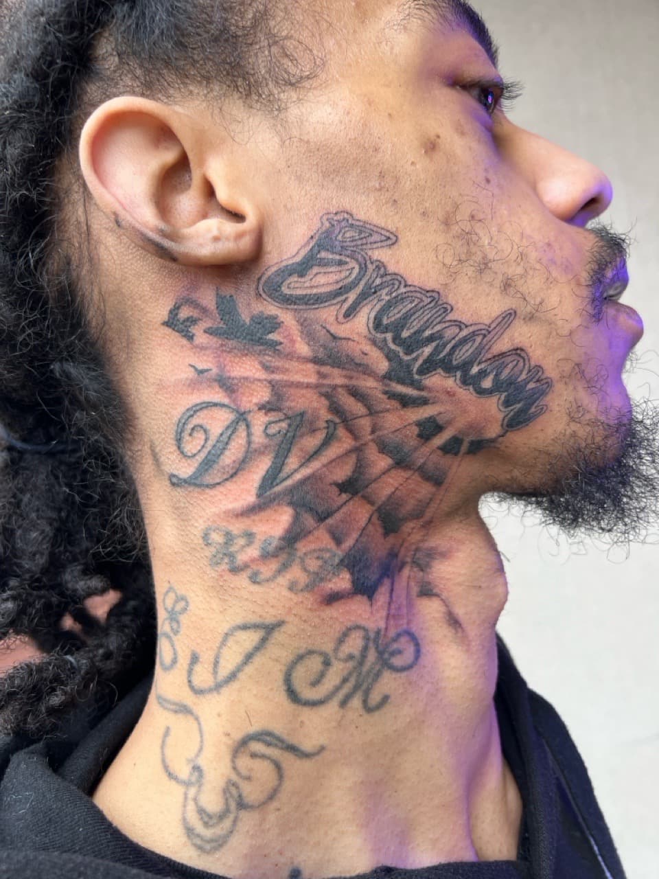 Lettering + Script name tattoo on Face by Sierato_Tattoos on TattMe