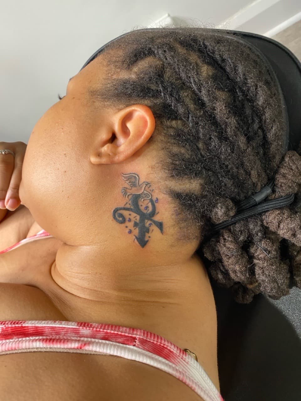 Black-work + Illustrative prince symbol tattoo on Neck (Side) by Sierato_Tattoos on TattMe