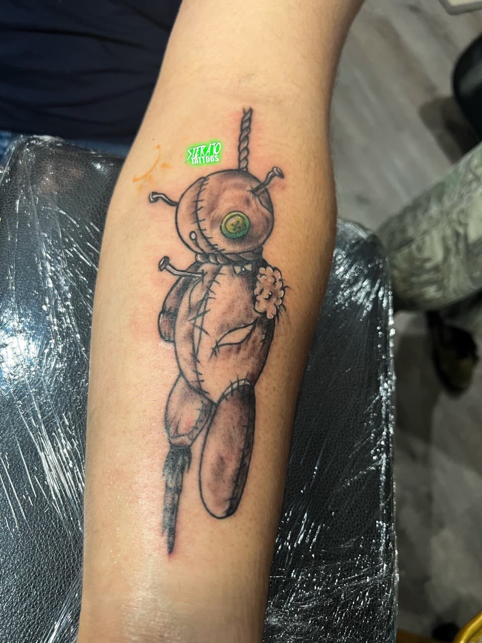 Illustrative + Black & Grey voodoo doll tattoo on Forearm by Sierato_Tattoos on TattMe