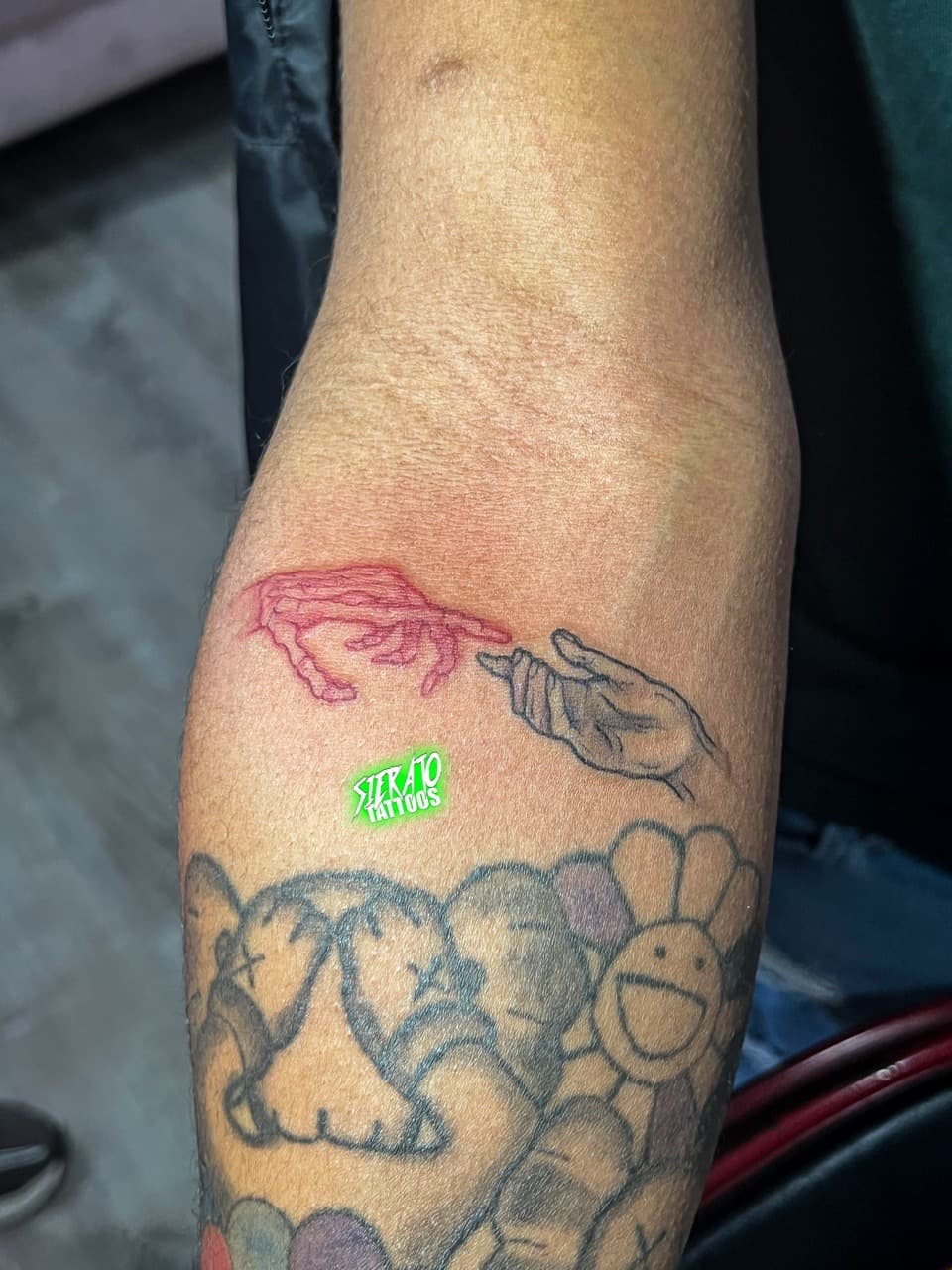 Fine Line + Illustrative hands tattoo on Upper Arm by Sierato_Tattoos on TattMe