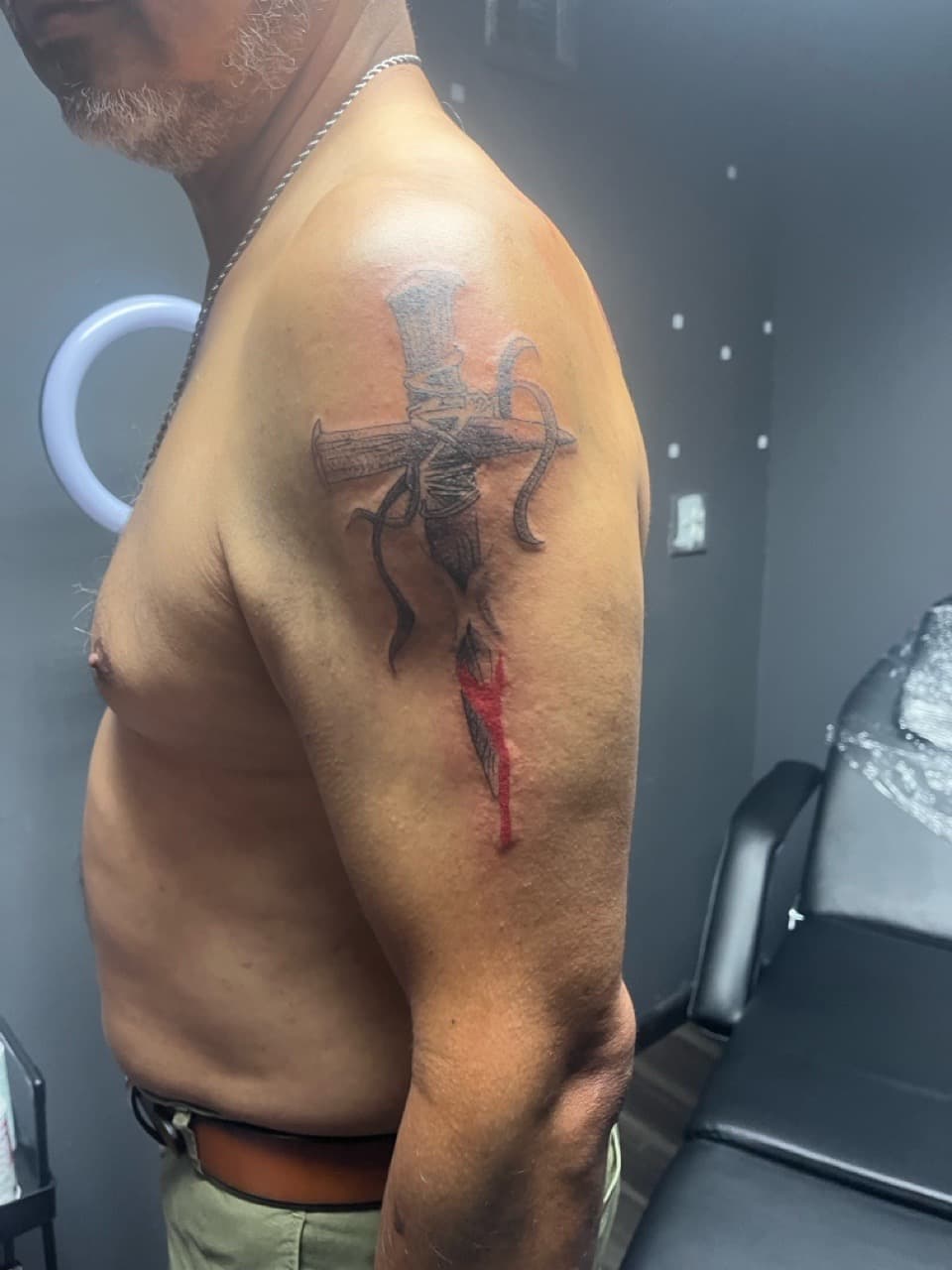 Black & Grey + Illustrative cross tattoo on Upper Arm by Titan_Ink on TattMe