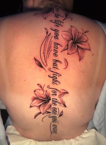 Black & Grey + Fine Line lilies tattoo on Spine by inkstains_tattoo_studio on TattMe