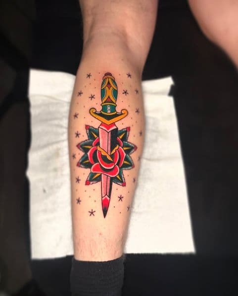 Traditional + American Traditional dagger tattoo on Calf by inkstains_tattoo_studio on TattMe