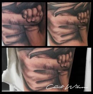 Realism + Black & Grey hands tattoo on Upper Arm by Clint_Wilson on TattMe