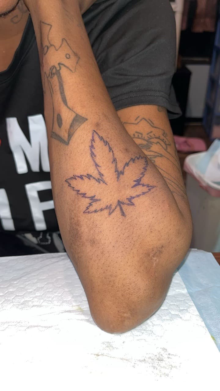 Line-work + Black-work cannabis tattoo on Upper Arm by ink_Queens_Crystal on TattMe